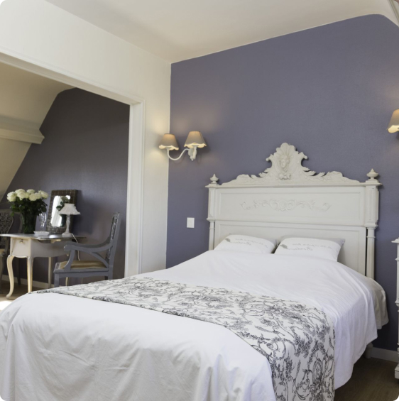 Elegant room with charming bed, pastel decor and desk area, in the heart of Villa les Mots Passants in Cabourg.